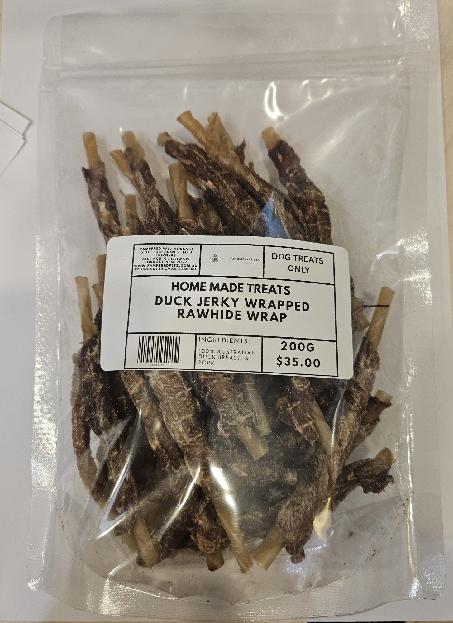 PAMPERED PETZ HORNSBY HOME MADE TREATS DUCK JERKY WRAPPED RAWHIDE WRAP 200G